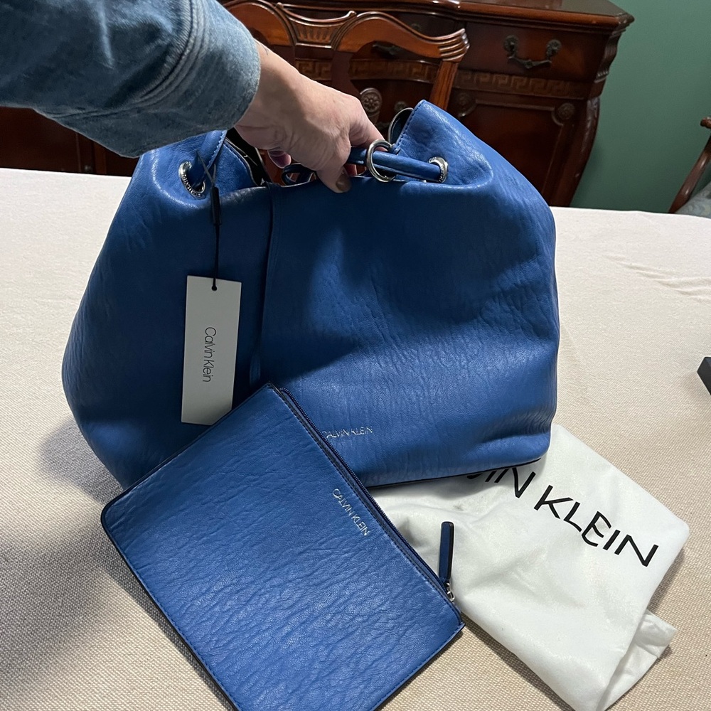 Calvin Klein Blue tote Bag with zippered clutch  and dust bag. NWT